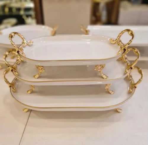 Elegant serving plates with gold coloured Handles