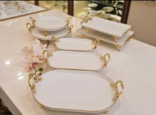 Elegant serving plates with gold coloured Handles